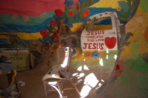 Leonard continued his narrative, before a car door imbedded within an inner wall of the thing, emblazoned with "JESUS loves you, you love JESUS"