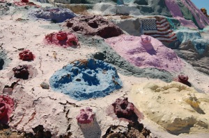 Floral pustules of brightly-colored adobe break out upon all surfaces.