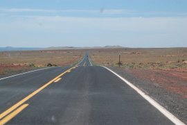 Crater Rim of Meteor Crater in Arizona, in the middle distance.