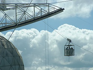 The antenna is in the distance beyond the guys in the gondola, so of course it's still bigger than it looks.