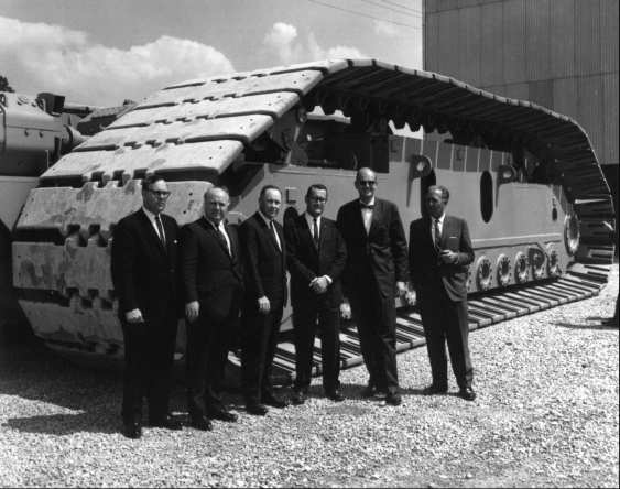 VIPs in front of crawler truck